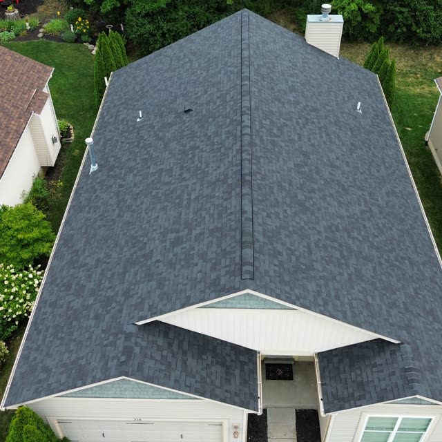 Aerial ridge view of a newly installed shingle roof