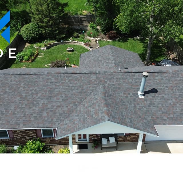 Finished charcoal roof on a brick ranch home