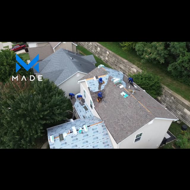 Aerial view of crews drying in a residential roof