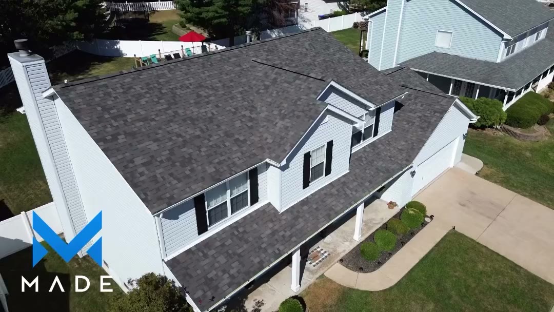 Finished dark shingle roof with dormers